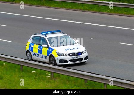 2020 Police Highway Patrol Peugeot 308 Access Bluedi S/S start stop Diesel 1498cc hatchback; travelling on the M61 Motorway, Manchester, UK Stock Photo