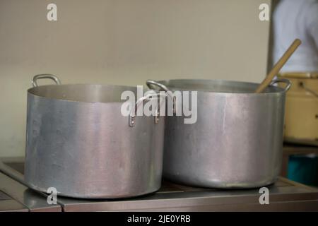Large metal pans in an industrial kitchen. Stock Photo
