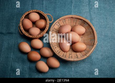 Chicken eggs in the wicker basket Stock Photo