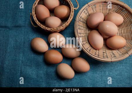 Chicken eggs in the wicker basket Stock Photo