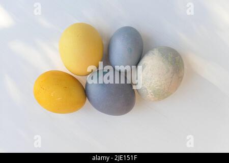 Painted Easter eggs colorful pastel collection, naturally dyed. Yellow and blue Easter eggs. Stock Photo