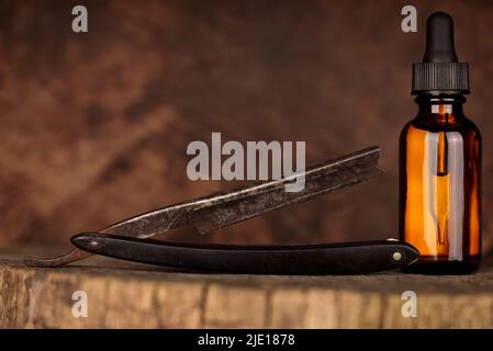 Mockup of beard product, grooming oil. Conceptual background of men's hair salon, barber shop. Stock Photo