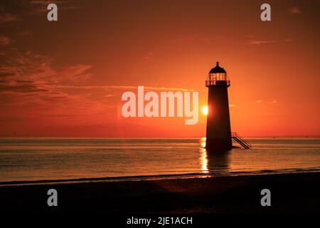 Sunrise over Talacre lighthouse on the North Wales coast Stock Photo