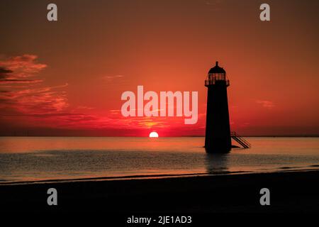 Sunrise over Talacre lighthouse on the North Wales coast Stock Photo