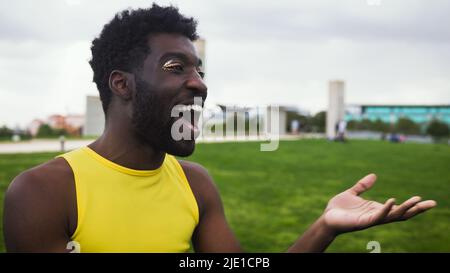 Happy African gay man celebrating pride festival - LGBTQ community concept Stock Photo