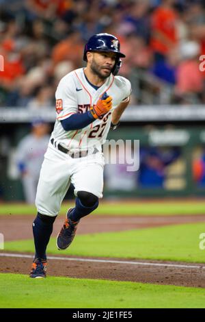 Houston Astros' Jose Altuve hits a sacrifice fly, scoring a run, off
