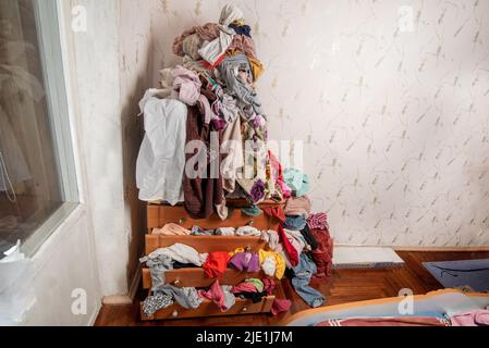 dpa) - A woman tries to find some clothes that fit her in a large