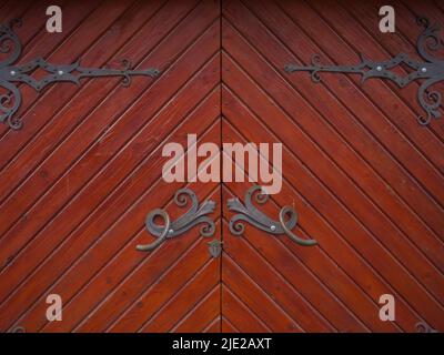 Ancient wooden door with iron curtains Stock Photo