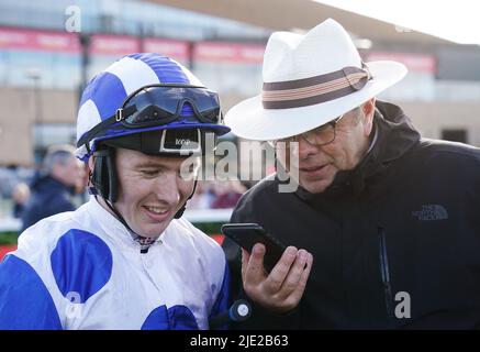 Jockey Colin Keane (left) and trainer Ger Lyons in the parade ring after winning the Comer Group International Curragh Cup with Camorra during day one of the Dubai Duty Free Irish Derby Festival at Curragh Racecourse in County Kildare, Ireland. Picture date: Friday June 24, 2022. Stock Photo