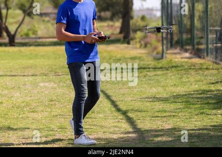 A young men flying a drone Stock Photo