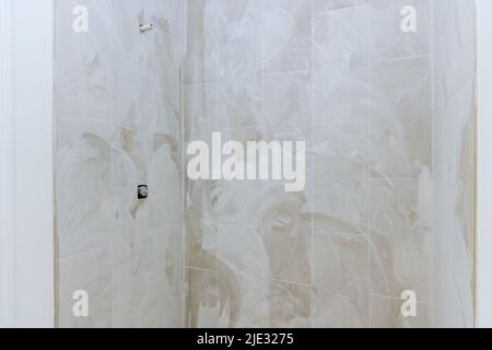 Under construction with bathroom in a shower for new home Stock Photo