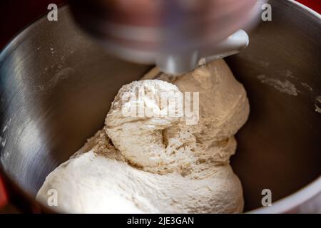Pizza Dough mixing in a Kitchen Aid mixer. Stock Photo