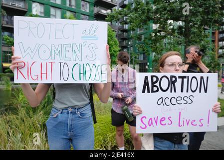 London, UK, 24th June, 2022. Protesters carrying signs: 'Protect women's right to choose' and 'Abortion access saves lives!' gathered outside the American embassy in Vauxhall following the U.S. Supreme Court's decision to end the constitutional right to abortion - in place for almost 50 years following the 1973 Roe v Wade ruling.  Individual states will decide how to proceed, with thirteen automatically banning the medical procedure outright as trigger laws took effect. Credit: Eleventh Hour Photography/Alamy Live News Stock Photo