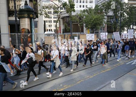 San Francisco, United States. 24th June, 2022. Protesters march on the streets of San Francisco, holding placards expressing their opinion abortion during the demonstration. In San Francisco, hundreds of protesters took to the streets with placards; they want to uphold their abortion right and they think abortion or not should be decided by the women, not the court. This rally was following the court ruling, for June 24, in which the U.S. Supreme Court overturned Roe v. Wade case, meaning the United States ending federal abortion protection. Credit: SOPA Images Limited/Alamy Live News Stock Photo
