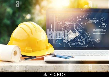 Laptop of a architect who plans a house Stock Photo