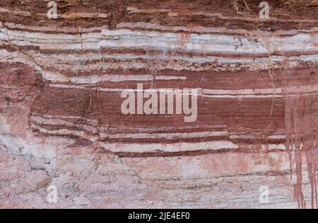 beautiful rock from colored layers background Stock Photo