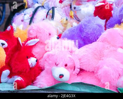 Cute Dog Shaped fluffy Teddy bear toy for kids and children for sell in street shop, Furry toys of Cartoon Characters, ready to sell in market Stock Photo