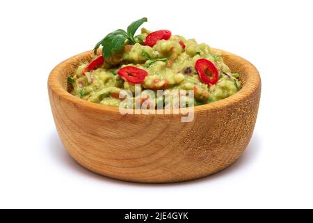 Wooden bowl of guacamole dip sauce isolated on white background Stock Photo