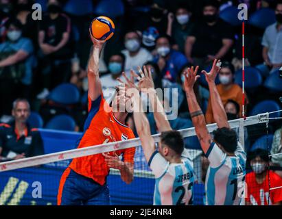 Quezon City, Philippines. 25th June, 2022. The Netherlands' Stijn van Tilburg (L) spikes the ball during the FIVB Volleyball Nations League Men's Pool 3 match between the Netherlands and Argentina in Quezon City, the Philippines, June 25, 2022. Credit: Rouelle Umali/Xinhua/Alamy Live News Stock Photo