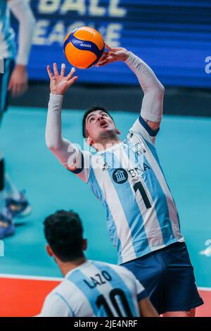 Quezon City, Philippines. 25th June, 2022. Argentina's Matias Sanchez (R) sets the ball during the FIVB Volleyball Nations League Men's Pool 3 match between the Netherlands and Argentina in Quezon City, the Philippines, June 25, 2022. Credit: Rouelle Umali/Xinhua/Alamy Live News Stock Photo