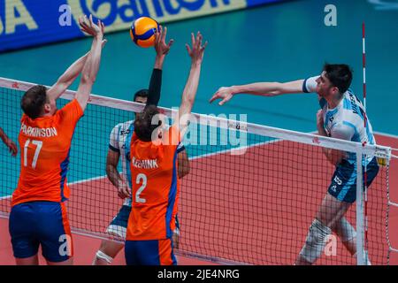 Quezon City, Philippines. 25th June, 2022. Argentina's Luciano Vicentin (R) spikes the ball during the FIVB Volleyball Nations League Men's Pool 3 match between the Netherlands and Argentina in Quezon City, the Philippines, June 25, 2022. Credit: Rouelle Umali/Xinhua/Alamy Live News Stock Photo
