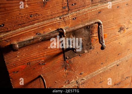 Detail of Deadbolt on old wooden door Stock Photo