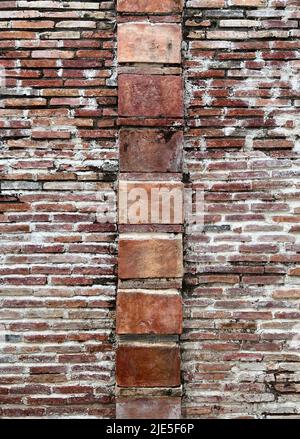 Brick wall background in various Red tones and various brick sizes, constructed as rows as retro style building Stock Photo