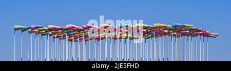 Artwork Le Vent Souffle où il Veut by artist Daniel Buren, hundred flag poles with colorful windsocks at Nieuwpoort / Nieuport, West Flanders, Belgium Stock Photo