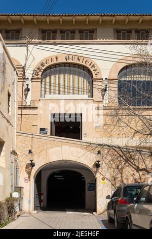 Felanitx, Spain; april 07 2022: Main facade of the historic building that houses the municipal market in the Majorcan town of Felanitx, Spain Stock Photo