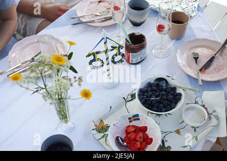 The celebration of Swedish Midsummer Eve on Friday. Here during a breakfast. Stock Photo