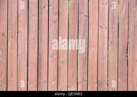 outdoor wooden fence planks painted with brown paint Stock Photo