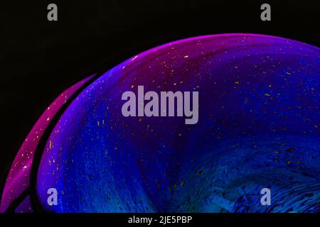 Beautiful psychedelic abstractions on the surface soap bubbles. Stock Photo
