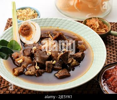 Rawon. Traditional Indonesian Beef Black Soup Culinary Stock Photo