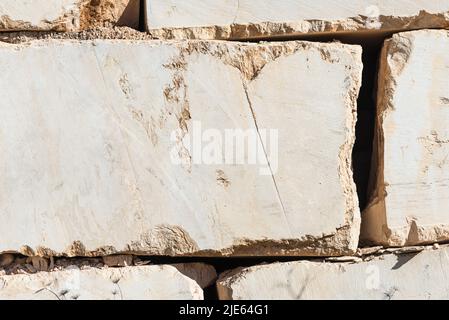 Surfaces of stacked angular marble blocks in a quarry near Orosei on the east coast of Sardinia, Baronia,Italy Stock Photo