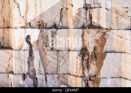 Rock face with the cut edges of the stone blocks in a marble quarry near Orosei on the east coast of Sardinia, Baronia,Italy Stock Photo