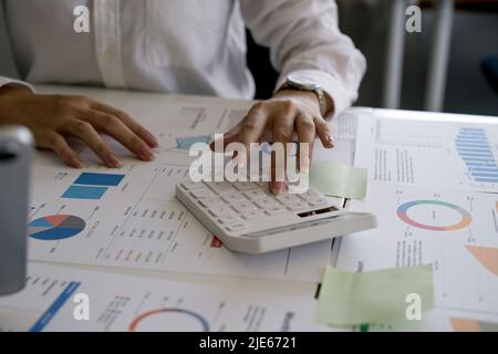 Close up view of bookkeeper or financial inspector hands making report, calculating or checking balance. Home finances, investment, economy, saving Stock Photo