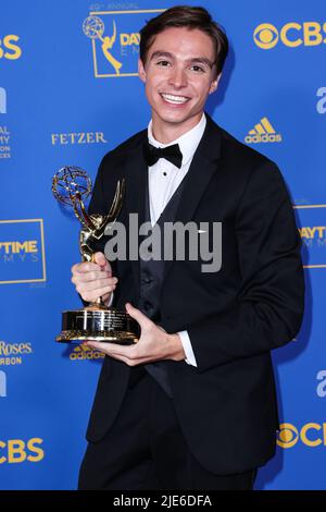 Nicholas Chavez poses in the press room with the award for outstanding