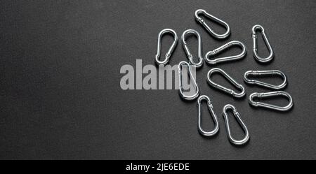 4mm climbing carabiner isolated against a dark background Stock Photo