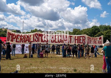 Munich, Germany. 25th June, 2022. People take part in a demonstration in Munich, Germany, on June 25, 2022 to protest against Group of Seven (G7) summit, which is to be held in Bavaria. Credit: Ren Ke/Xinhua/Alamy Live News Stock Photo