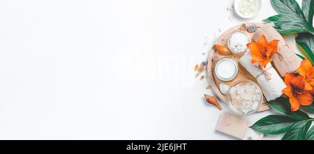 Spa composition with lilies and spa accessories on a light background. Stock Photo