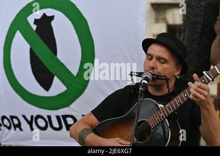 London, UK. 25th June, 2022. Singer Sean Taylor performs at the anti-NATO protest, opposite Downing street, London, UK. - 25 June 2022. Credit: See Li/Picture Capital/Alamy Live News Stock Photo
