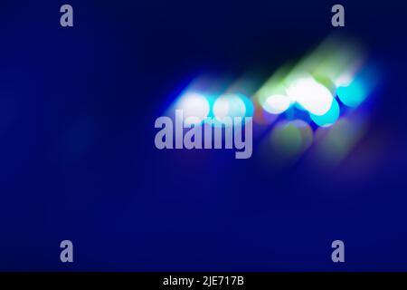 Smooth transitions of iridescent colors. Iridescent sparkling multicolor blurred glow on black Stock Photo
