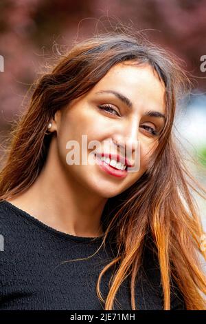 During a photoshoot in Dundee city centre a stunning 38-year-old European woman poses glamorously for the camera, Scotland, UK Stock Photo