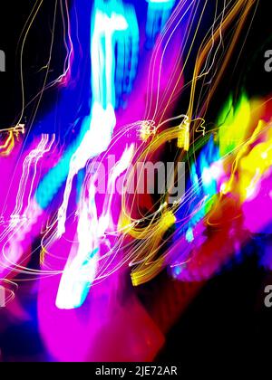 Iridescent light neon colors blur background. Vapor wave vibrant blurred bokeh gradient texture. Stock Photo