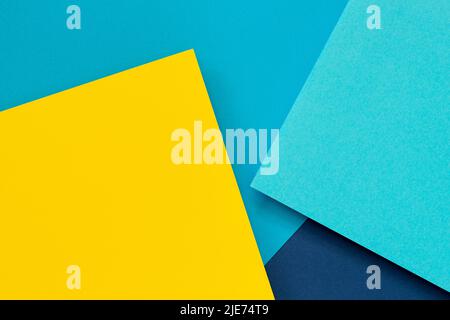 Abstract color papers geometry flat lay composition background with blue and yellow tones Stock Photo