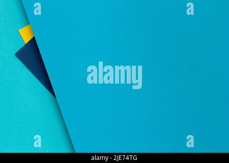 Abstract color papers geometry flat lay composition background with blue and yellow tones Stock Photo