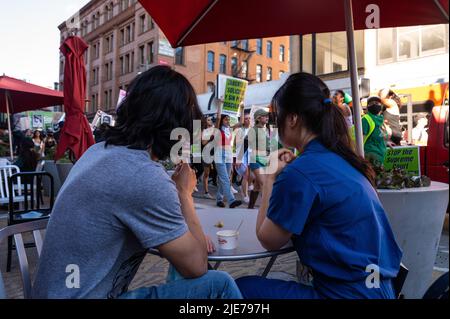 Los Angeles, California, USA. 24th June, 2022. Onlookers watch hundreds of abortion-rights protesters march through Downtown Los Angeles after Roe v. Wade ruling. (Credit Image: © Raquel Natalicchio/ZUMA Press Wire) Stock Photo