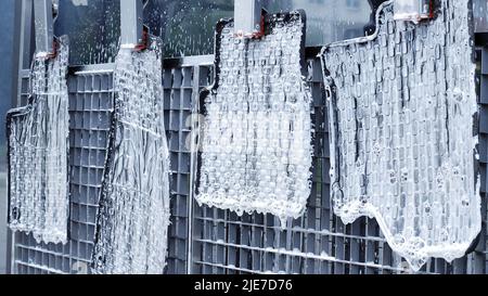 Washing rubber car carpets in a with a hose that supplies water under pressure Stock Photo