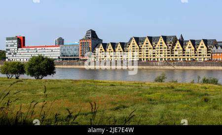 Modern residential buildings on river banks of Rhine river in Cologne Stock Photo