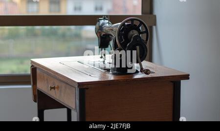 old sewing machine in disuse Stock Photo